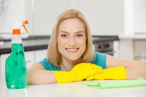 After builders cleaning removing dust from a newly renovated room