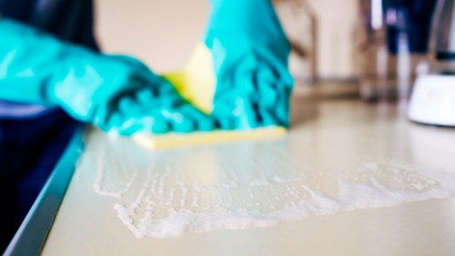 Manual oven cleaning with cloth and cleaning paste